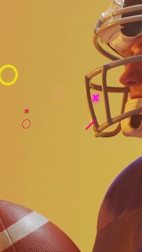 Vertical video: Player catching football from left, cam zooming, rings tracking grip, showing catch