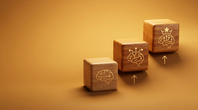 Three wooden cubes with brain, adaptive-path, and mastery-star icons in ascending order on a warm amber background for adaptive learning concepts.