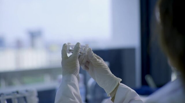 two-scientists-inspecting-device