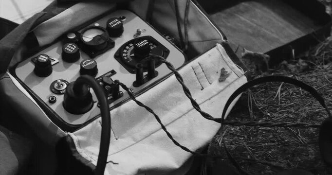 Vintage Radio Equipment on Wooden Log in Nature Scene