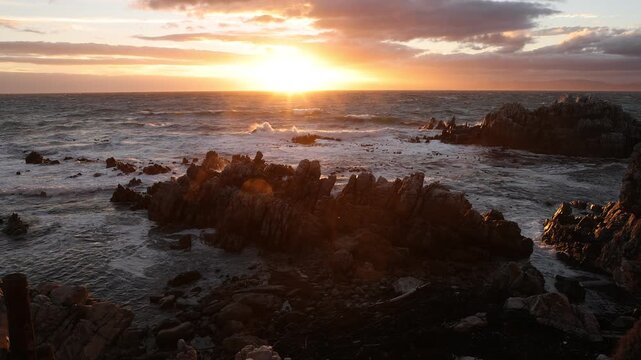 stormy sea meeting rocky coastline of DeKelders, South Africa