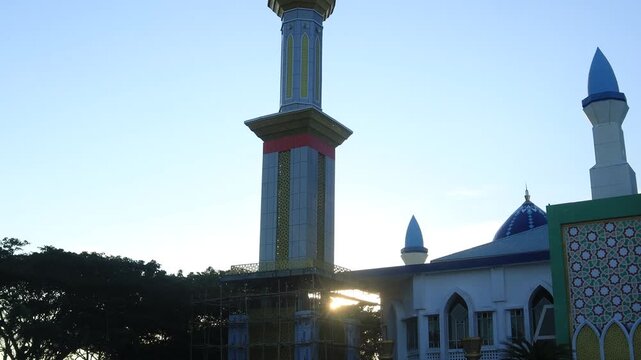 mosque tower with beautiful design against sky background