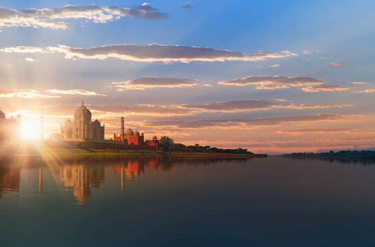 Taj Mahal mausoleum reflected in Yamuna river at amazing sunset - Agra, Uttar Pradesh, India