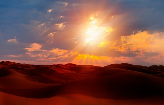 Sand dunes in the Sahara Desert at amazing sunrise, Merzouga, Morocco - Orange dunes in the desert of Morocco - Sahara desert, Morocco