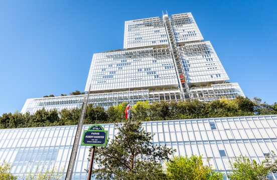Paris, France - April 7, 2026: Low angle view of the "Tribunal de Paris" (Courthouse of Paris), a 38 storeys, 160 metres high building by architect Renzo Piano, seen from the Parvis Robert Badinter.