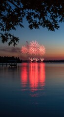 Fototapeta premium Red fireworks display reflecting on water for lakefront event advertising, holiday celebration marketing and patriotic evening festivities with lakeside dock background