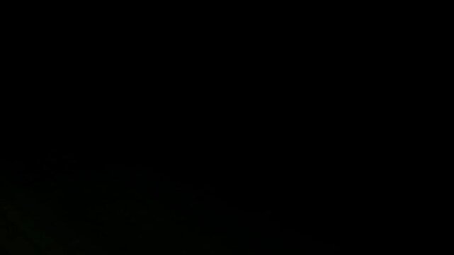 Abstract CRT strobe light glitches and scanlines. Vibrant RGB color streaks and analog signal distortion on black screen. Professional retro video transition and background overlay element.
