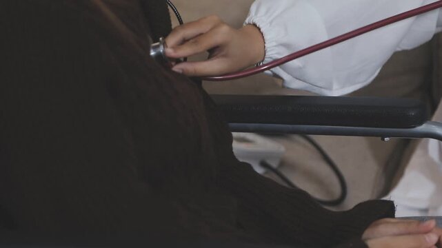 Doctor using a stethoscope checking patient with examining, presenting results symptom and recommend treatment method, Healthcare and medical concept