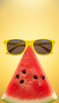 Slice of watermelon with yellow sunglasses, symbolizing summer, refreshment, and fun, ideal for vacation or summer themes