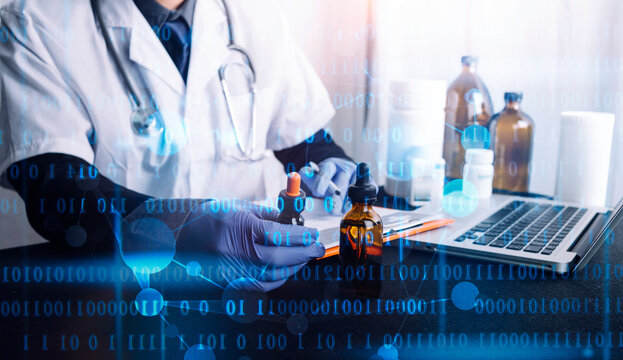 Doctor in white coat and blue gloves holding medicine bottles with laptop and medical supplies on table in bright room with blue binary code overlay