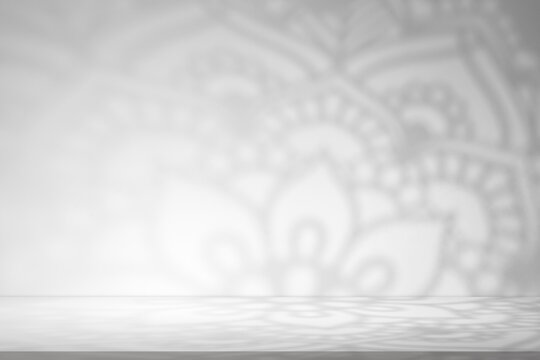 Eid Mubarak.Minimal Islamic background with soft sunlight casting arabesque geometric window shadows on grey wall.Vector studio room for Ramadan Kareem,Eid al Fitr,Mosque interior spiritual design