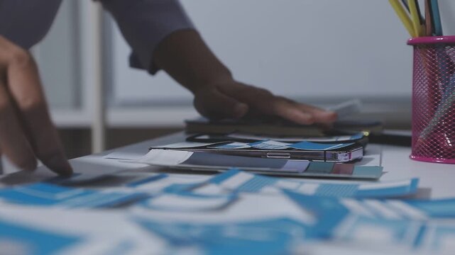 UXUI design collaboration with devices and sketches on table