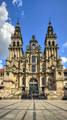 Fototapeta premium A large, ornate cathedral with two towers stands on a square