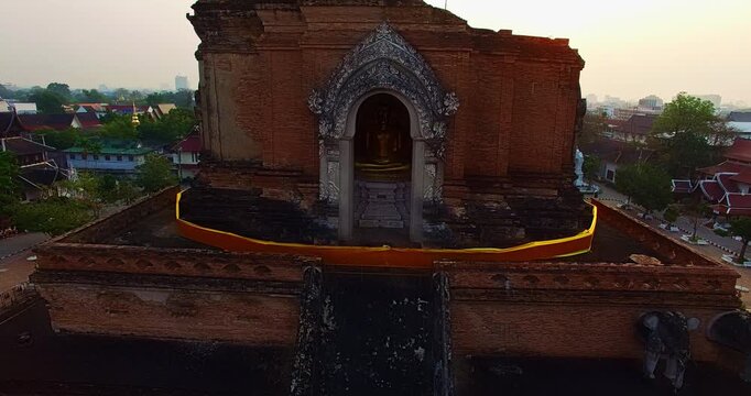 A breathtaking aerial view of Wat Chedi Luang, one of Chiang Mai&rsquo;s most important temples, located in the ancient walled city. The massive brick stupa rises above historic surroundings