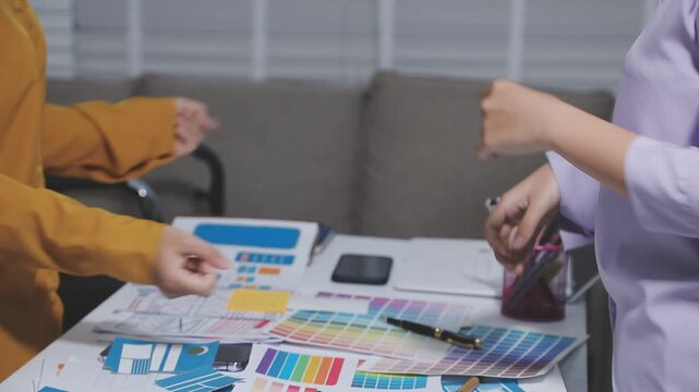 UXUI design collaboration with devices and sketches on table