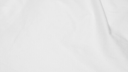 Fototapeta premium shot showing the subtle texture and soft folds of a white fabric surface.