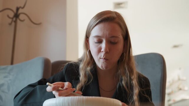Caucasian woman tasting hot soup at table, intimate food critic moment with spoon lift and steam, expressive reaction and mouth wipe, cozy armchair seating, blazer outfit, focused palate testing,