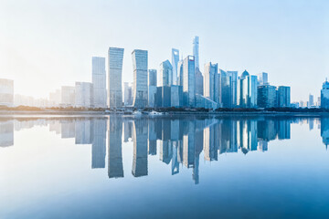 Obraz premium This is a serene cityscape view of a modern downtown skyline, perfectly reflected on the still surface of a nearby river at sunrise.