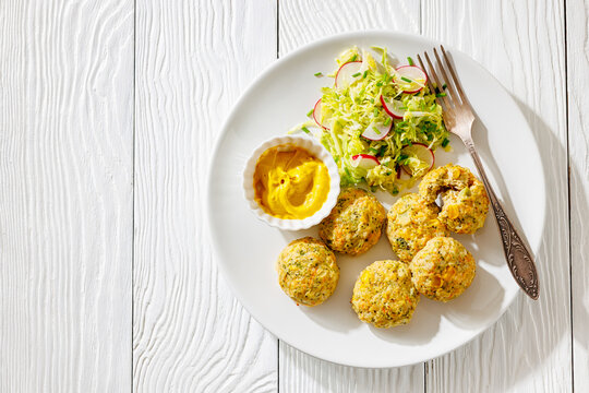 Baked meat and vegetable polpette with salad