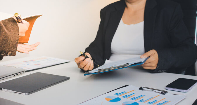 Accountants processing financial documents and taxes, managing corporate finance in a modern office. Audit and taxes in business