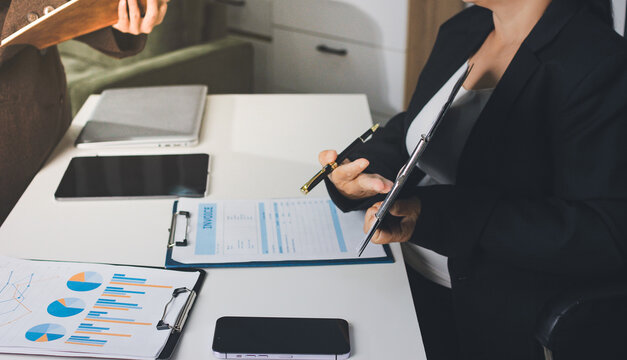 Accountants processing financial documents and taxes, managing corporate finance in a modern office. Audit and taxes in business