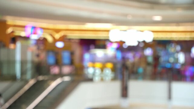 A blurred view of a bustling mall filled with shoppers, capturing the dynamic flow of modern consumer life and the vibrant pulse of the urban everyday