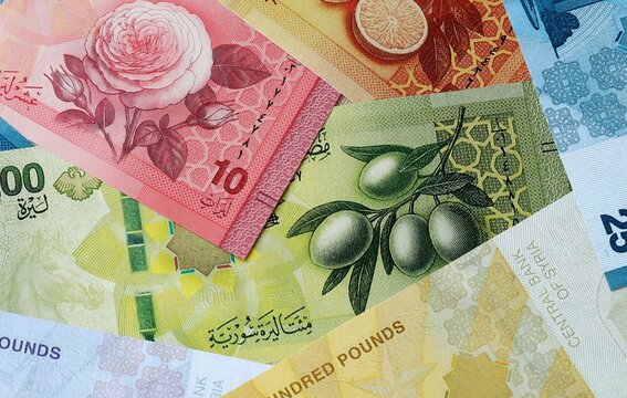 Syrian pound money banknotes bunch on table. Syria bills of SYP currency close up