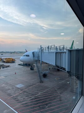 Turkmenistan Airlines Boeing 777 aircraft docked at the terminal gate in Tan Son Nhat International Airport (SGN), Ho Chi Minh City, Vietnam, 2025