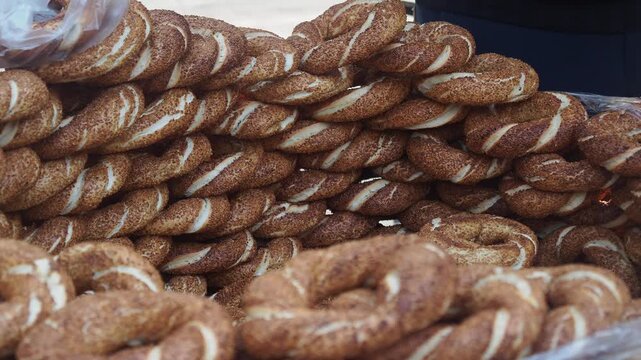 Hand Arranging Freshly Baked Turkish Simit Bread Rings