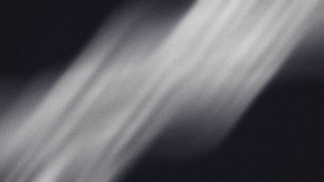 Abstract diagonal light beam overlay with soft grain texture and moody dark background for cinematic visual effects and artistic digital design compositions that require a subtle ethereal atmosphere