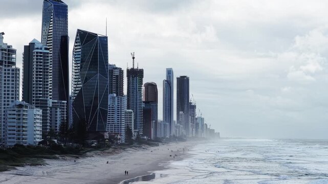 Long aerial view at Gold Coast Surfers Paradise waterfront sandy beaches pacific ocean.