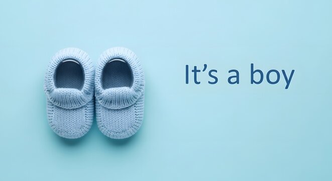 it's a boy announcement with blue knitted baby shoes on blue backgrouond.