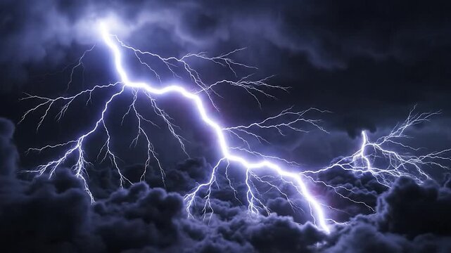 Powerful lightning strikes illuminating the dark night sky with intense electric bolts over stormy clouds
