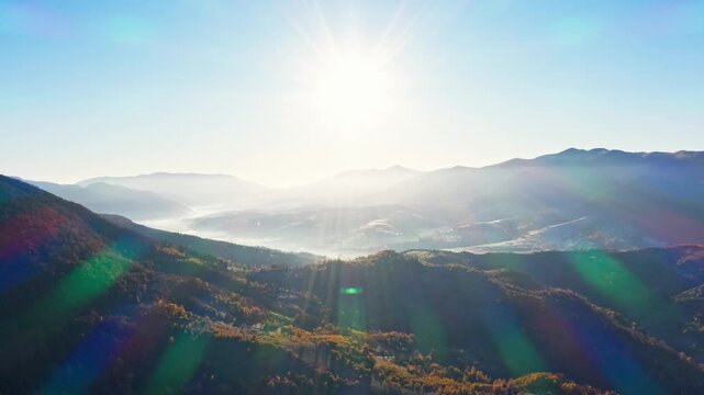 High mountains with terracota trees at bright sunrise