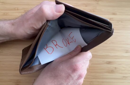 hands opening an empty wallet due to inflation and high prices