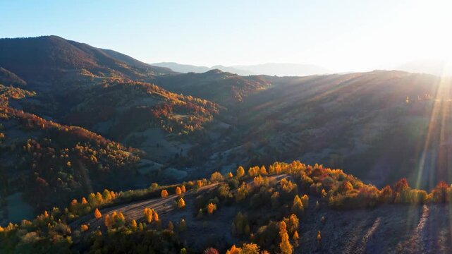 High mountains with terracota trees at bright sunrise
