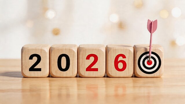 Business goal setting New Year 2026 planning success Wooden cubes with target and arrow