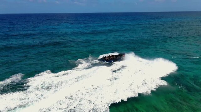Aerial Drone Shot of Wave Piercing Boat Making Aggressive U Turn in Open Ocean - 4K