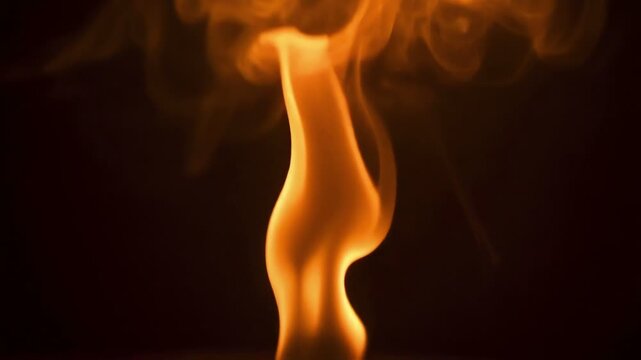 Flame burning on dark background.
