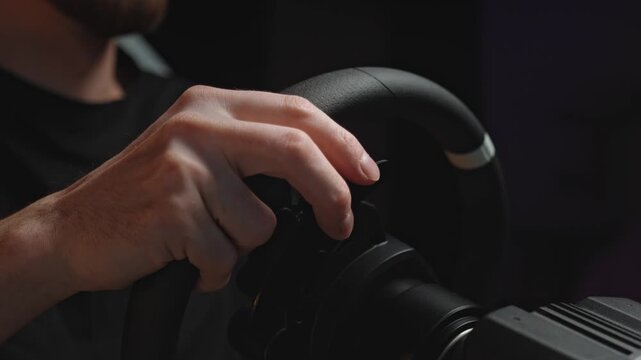 Hands finetuning racing wheel position and grip in dim studio, pro gamer warmup ritual with precise finger adjustments