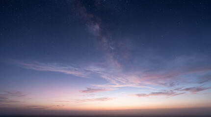 Obraz premium Milky Way Galaxy Over Beautiful Sunset Clouds in the Night Sky