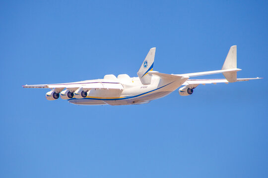 Plane Antonov AN-225 Mriya biggest airplane in the world. UR-82060 aircraft Air cargo. Tail plane. Back view, blue background Hostomel, Ukraine - April 23, 2020