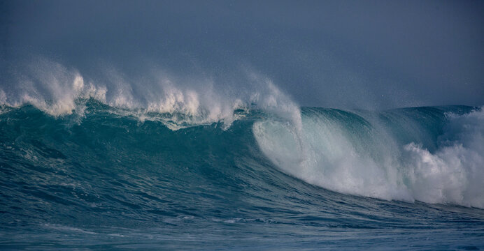Ocean scenery with copyspace. Huge waves crashing in ocean. Seascape environment background. Water texture with foam and splashes. Hawaiian surfing at Northshore in Oahy island
