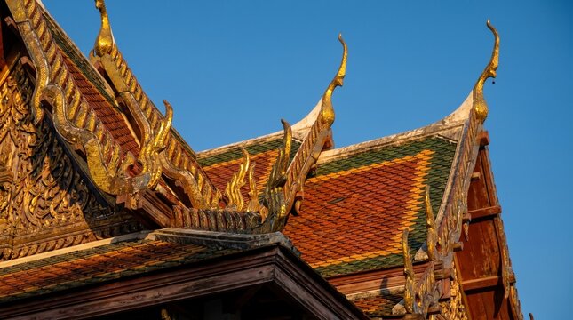 Intricate Golden Details of Traditional Thai Temple Roof Architecture