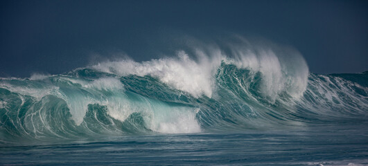 Huge waves crashing in ocean. Seascape environment background. Water texture with foam and splashes. Hawaiian surfing spots with nobody