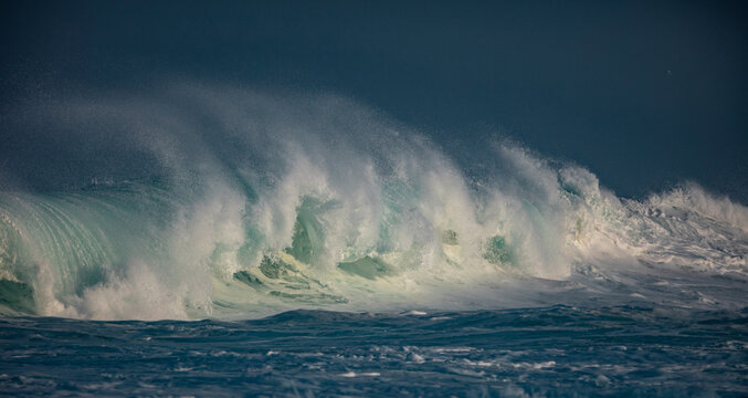 Huge waves crashing in ocean. Seascape environment background. Water texture with foam and splashes. Hawaiian surfing spots with nobody