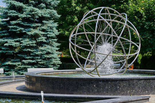 Elegant fountain with a metallic globe design