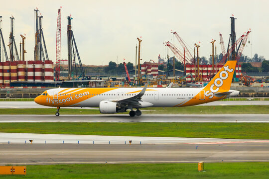 Singapore - 28 December, 2025: View to a passenger aircraft Scoot Airbus A321neo on runway at Changi Airport Singapore. Singapore-based low-cost airline, a subsidiary of Singapore Airline.