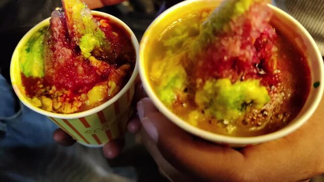 Tasty And Authentic Rabdi Gola of Indian Street Food With Colourful Suger Serub