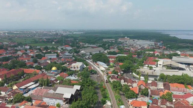 Aerial view of train traveling through probolinggo city in east java indonesia